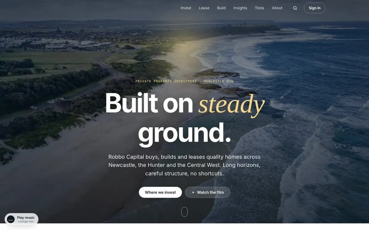 Robbo Capital website homepage with an aerial coastal photo and the headline Built on steady ground